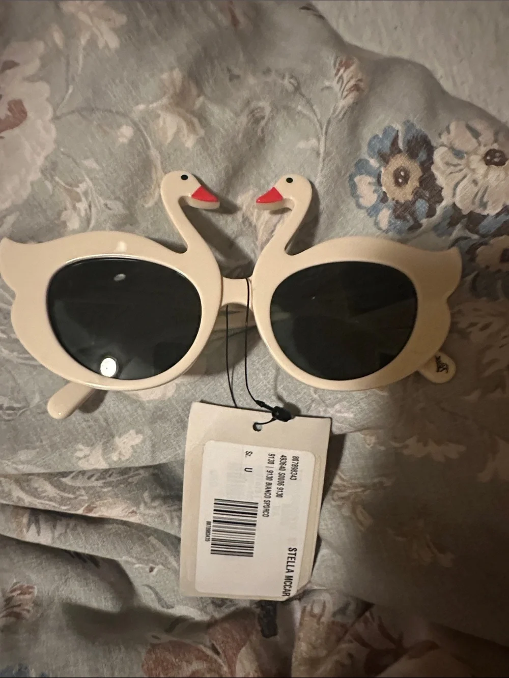 Stella McCartney Cream Swan Sunglasses with Black Lenses and Red Beak Accents